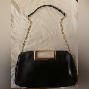 Michael Kohrs black and gold purse